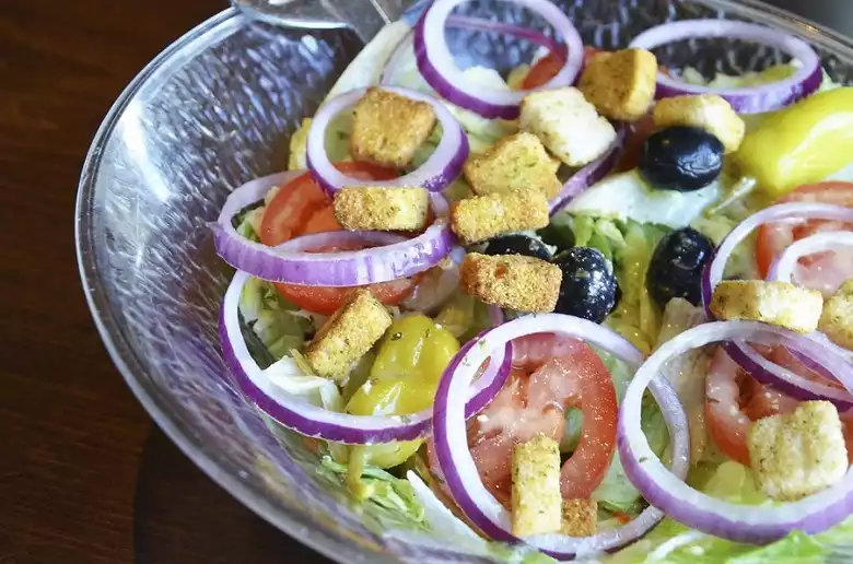 what cheese does olive garden use on salad